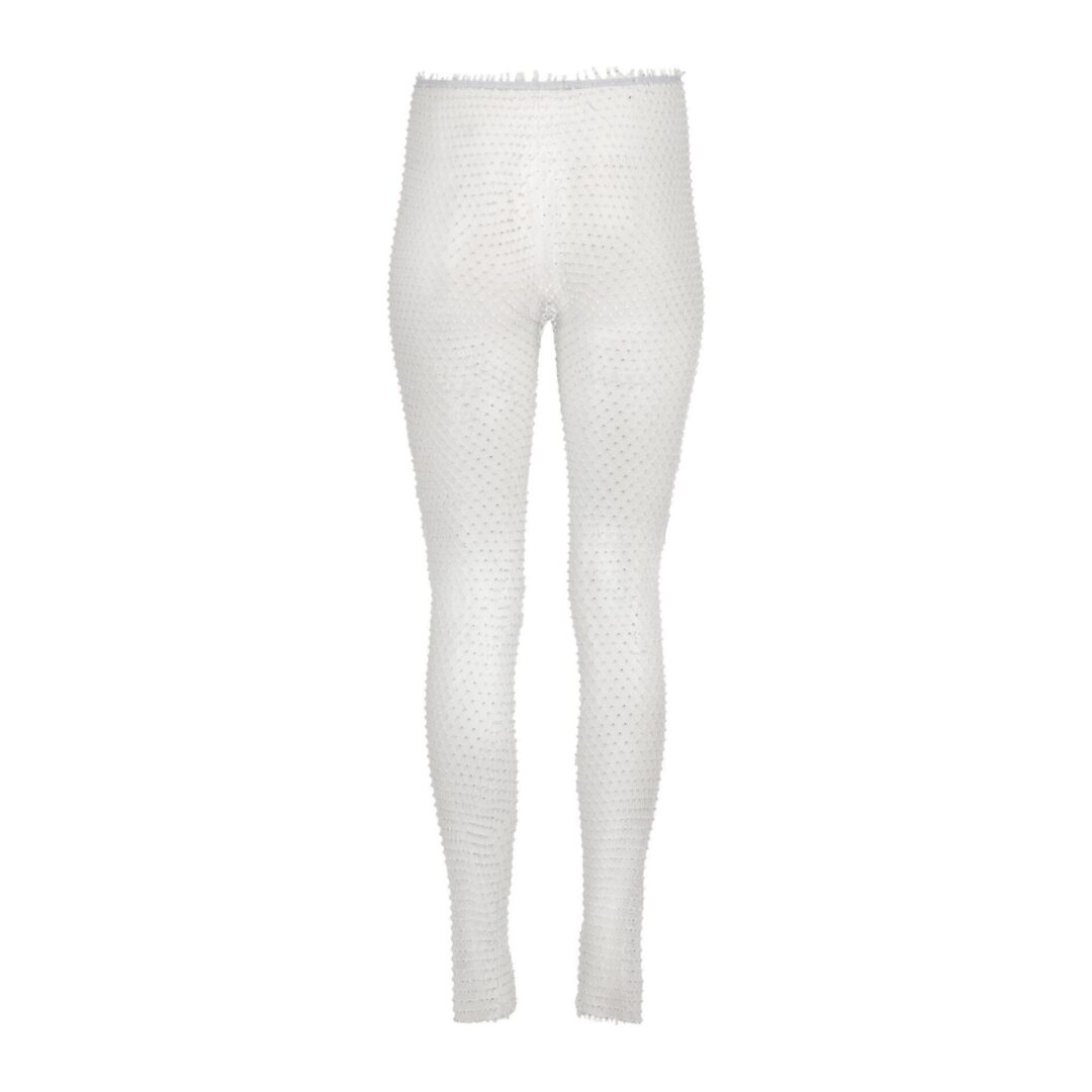 A pair of white leggings with a small black stripe on the bottom.